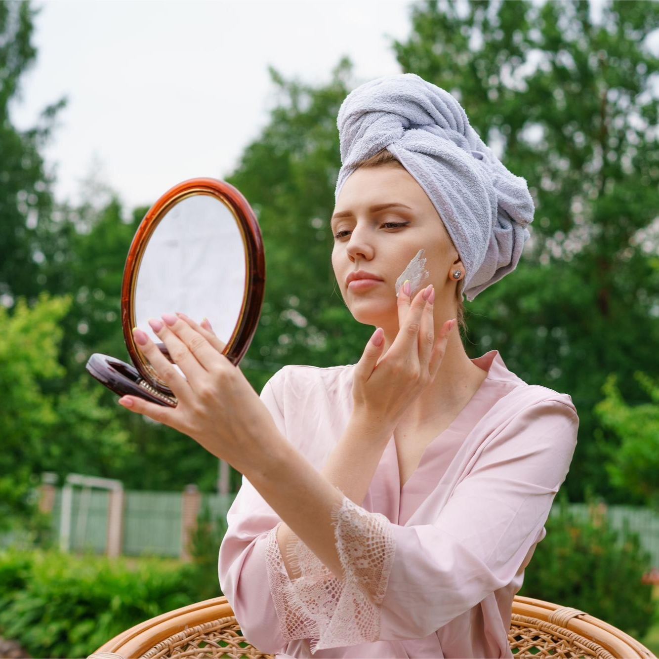 Woman gently using Prime Skincare Products